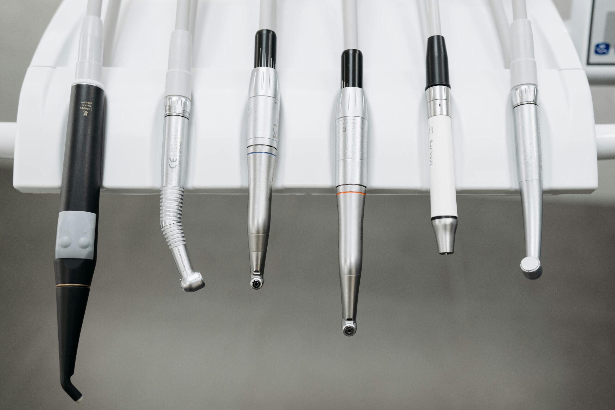 How Modern Denture Materials Improve Durability and Comfort 6 Close-up view of dental instruments organized in a holder, ready for use.